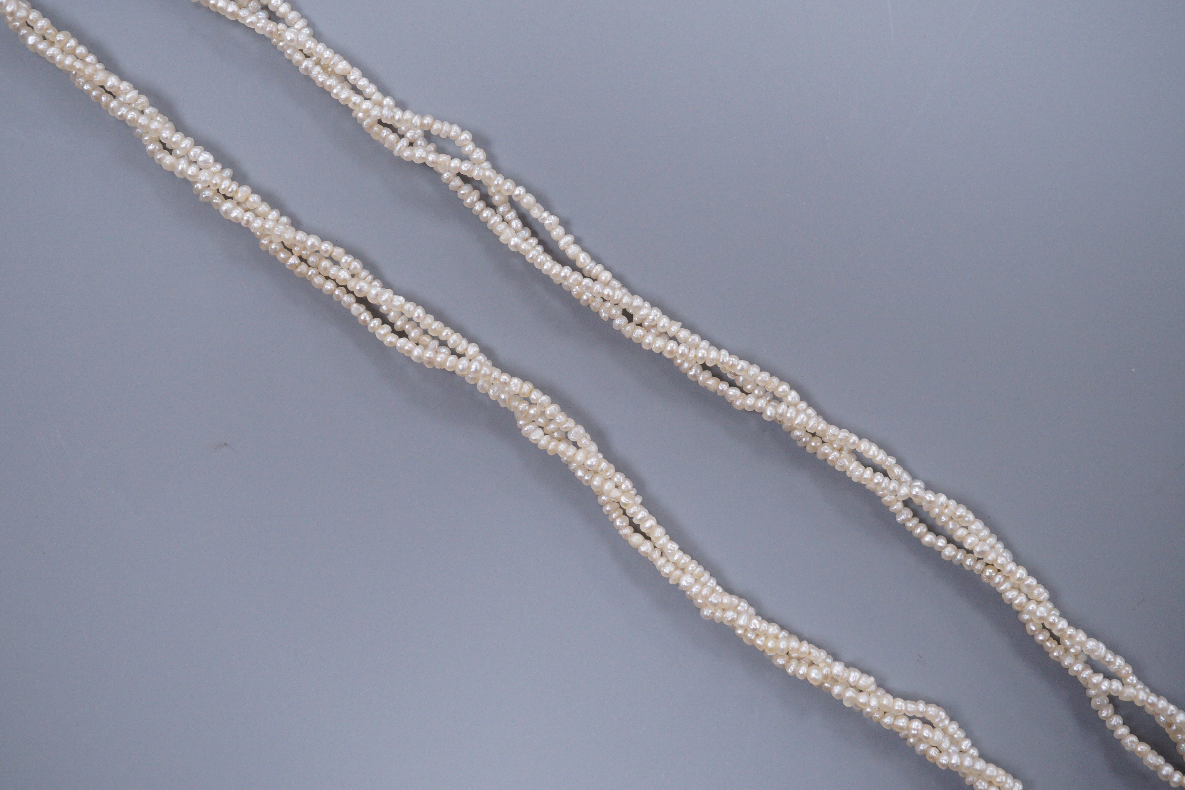 A Victorian triple strand seed pearl necklace, with gold clasp, 42cm